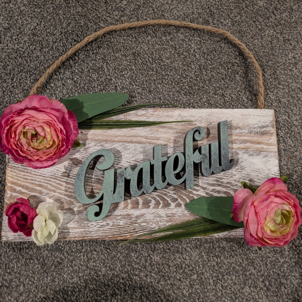 Grateful hanging sign